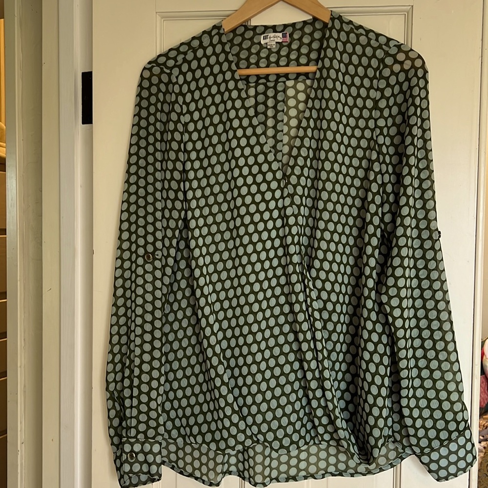 Flowy, green polka dot blouse.